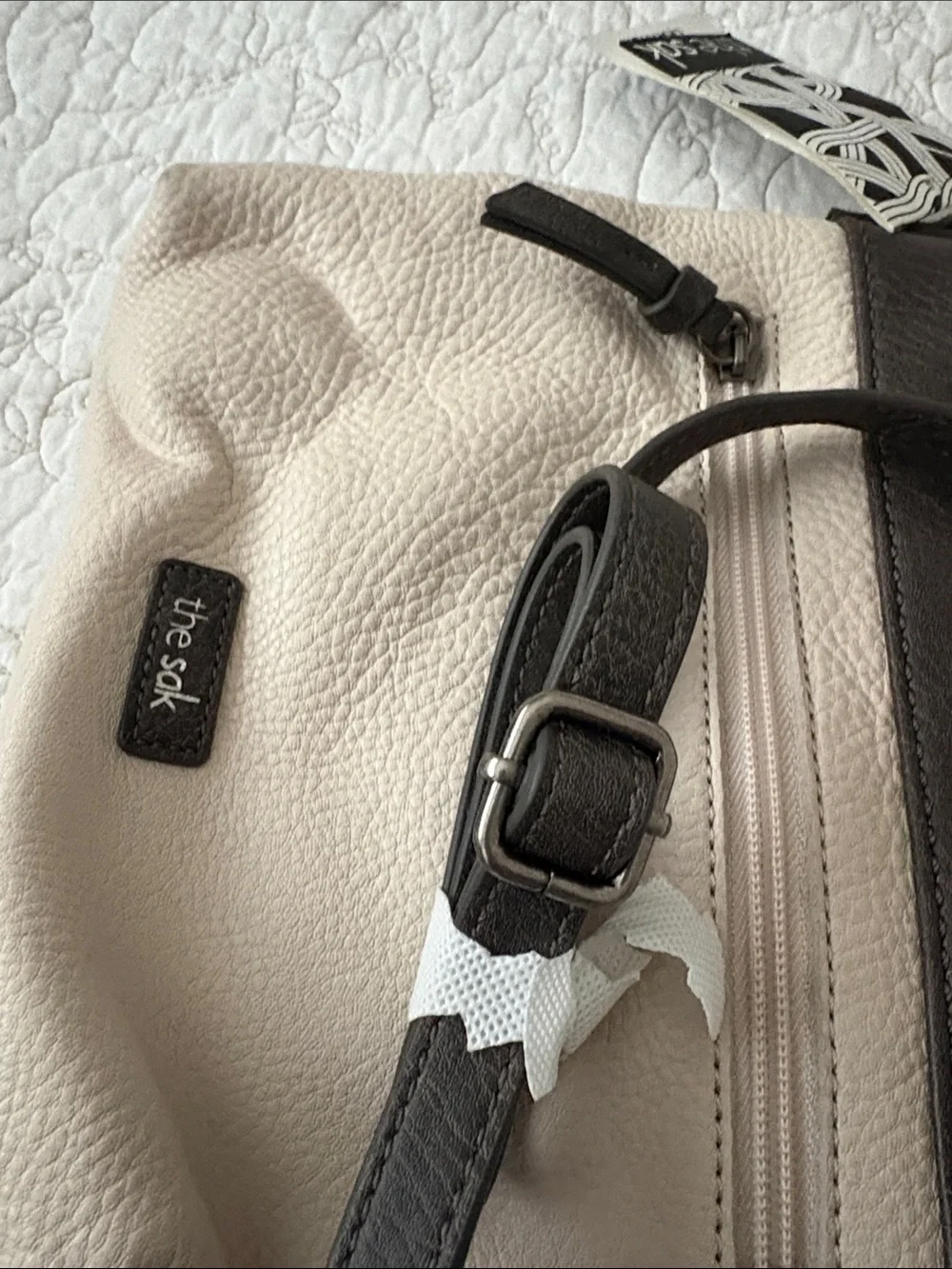 The Sak Leather Messenger Bag in Black and Cream Woven Front